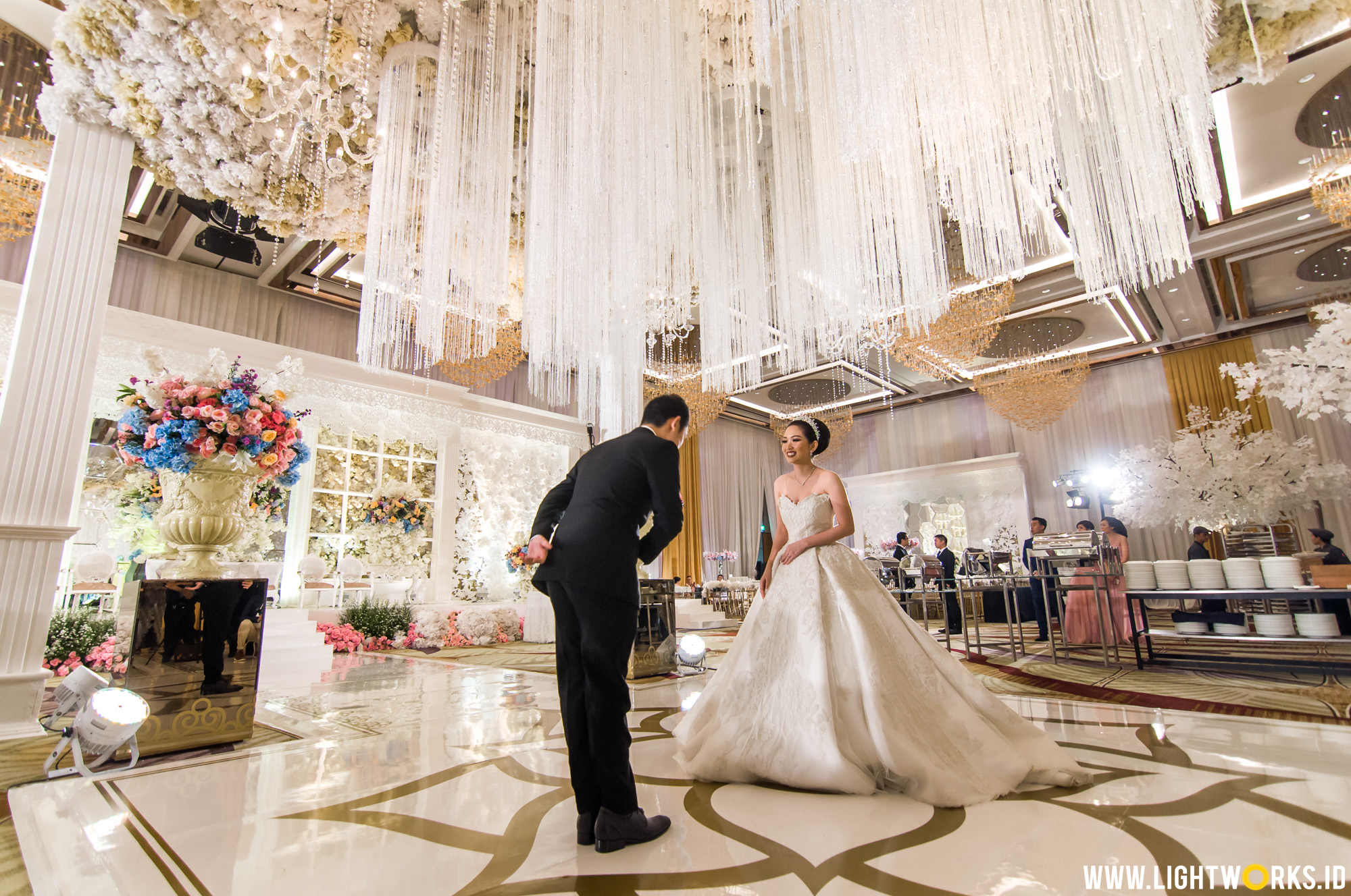 Wedding reception of Albert and Vienna | Venue at The Westin Jakarta | Organised by Private Wedding Organizer | Decoration by Lavender Decoration | Photo and video by Axioo | Cake by LeNovelle Cake, Miyominaki | MC by Allan Steven | Ushers by Stiletto Pagar Ayu | Gown by Albert Yanuar Bride & Couture | Make up by Andreas Zhu | Suit by Agus Lim | Lightworks