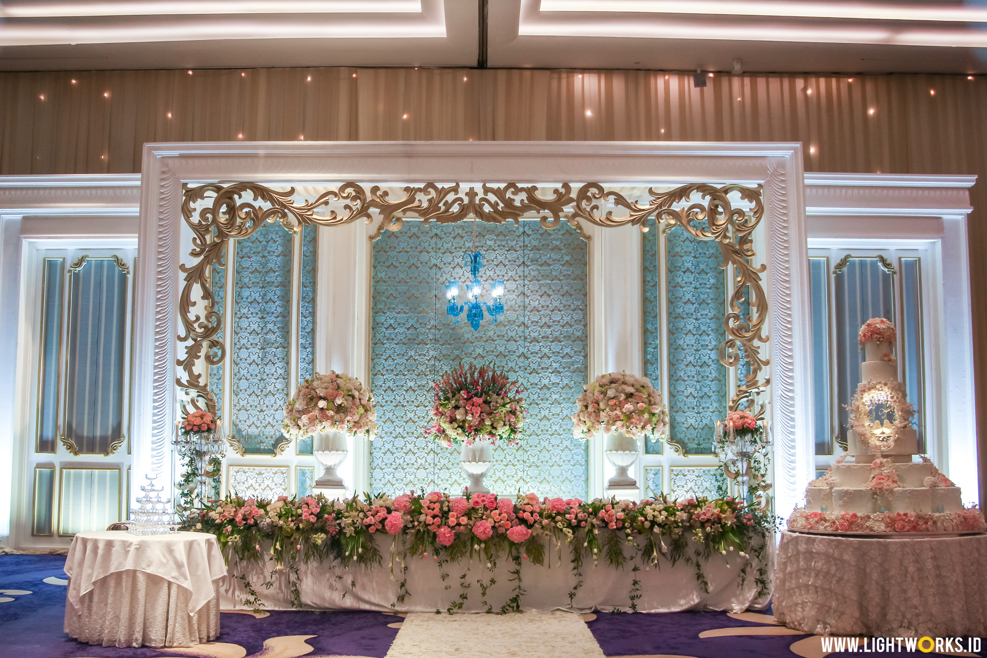 Iskandar and Shendy’s wedding reception | Venue at Raffles Hotel Jakarta | Decoration by Nefi Decor | Gown by Hian Tjen | Make up by Adi Adrian | Invitation by Million Yellow | Wedding car by Priority Rent Car | LED by Provis Rental | Wedding cake by LeNovelle Cake | Lighting coordinator: Steffi Indrajana | Lighting designer: Epafras Septian | Lighting by Lightworks